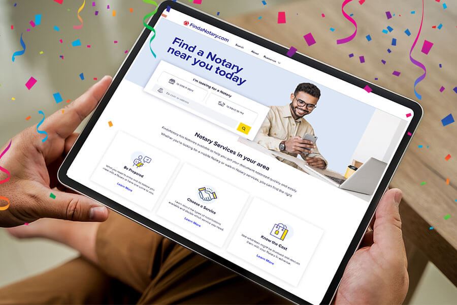 FindaNotary website displayed on a tablet with colorful confetti scattered around, celebrating FindaNotary's 1-year anniversary.