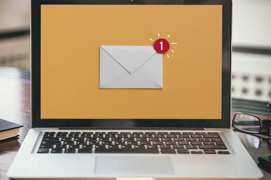 A laptop showing an email notification