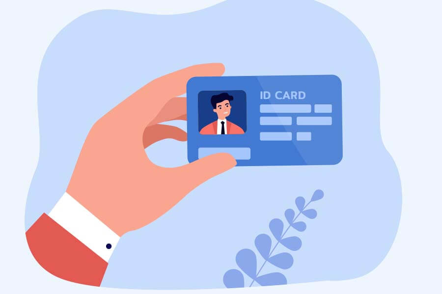 A person's hand holding an ID card illustration