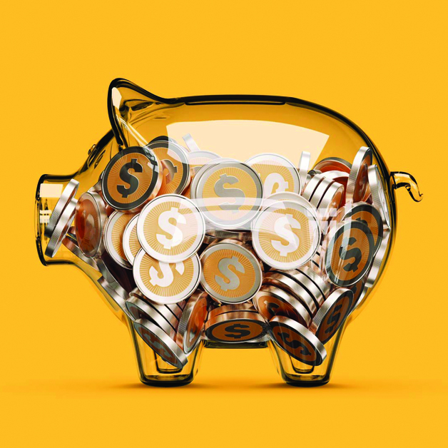 A transparent glass piggy bank filled with coins, set against a yellow background.