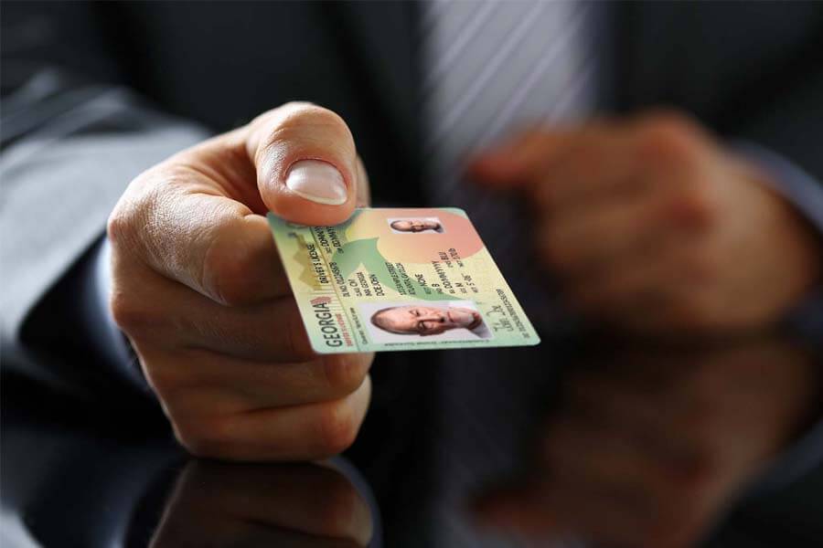 A person handing out the id card