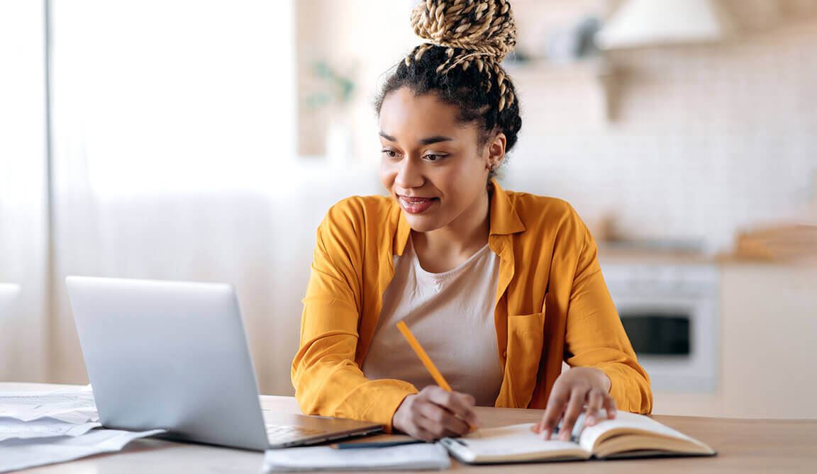 A female Notary participating in an online class